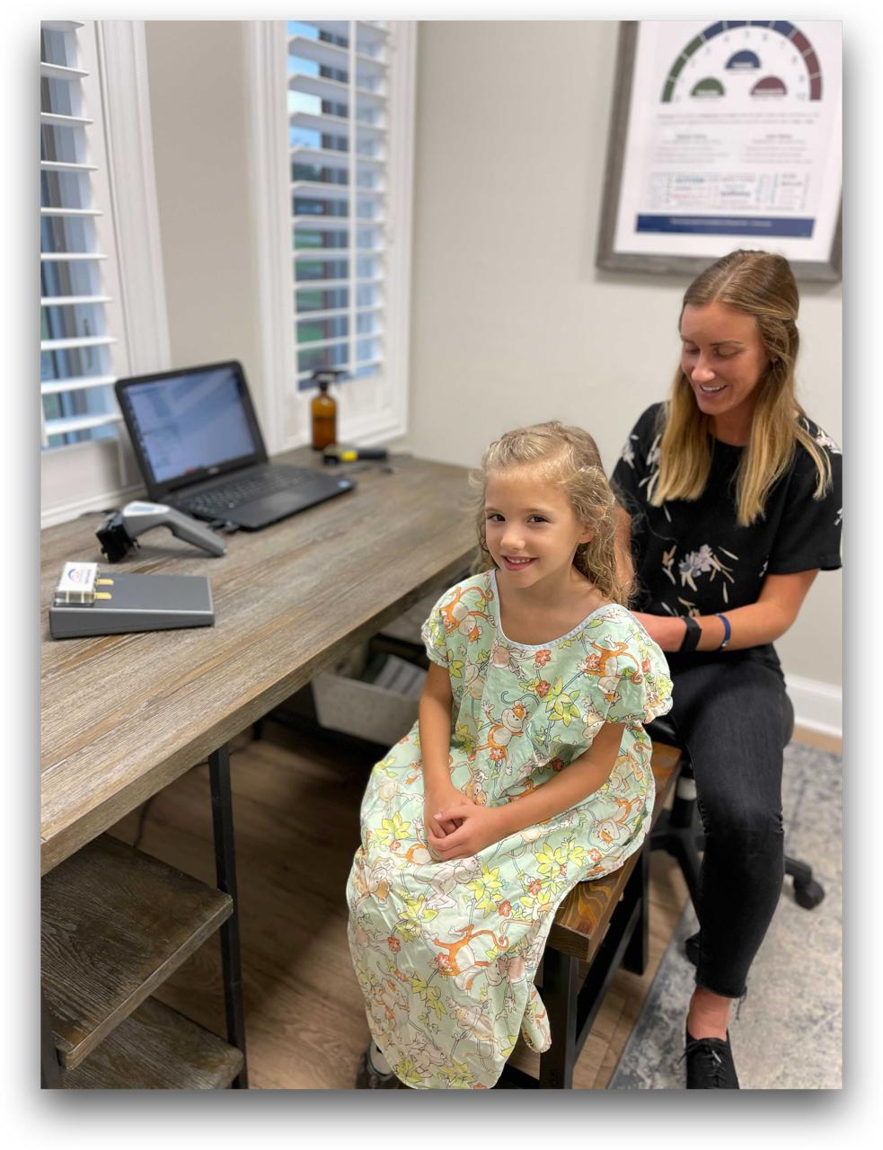 A child getting an INSiGHT scan with a Van Every doctor